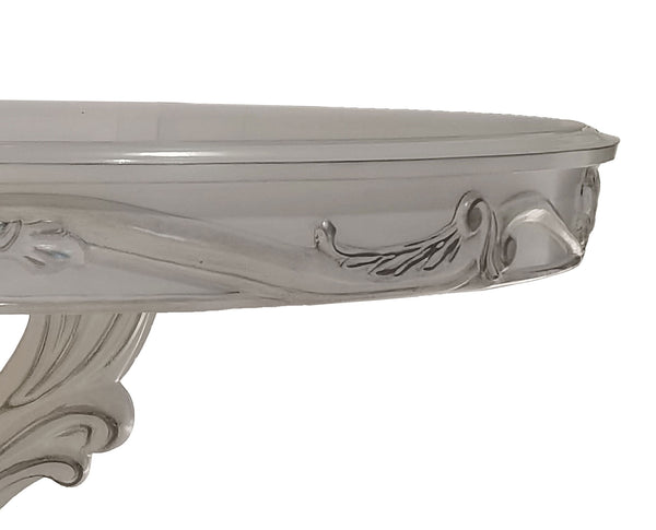 Traditional Style Round Dining Table Bone White Dresden Collection Close-up of a glossy white console table corner showing ornate carved details and a curved support leg against a plain white background.