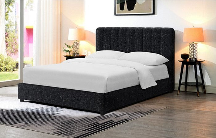 Traver Padded Vertical Channel Headboard Bed White Black upholstered bed with white bedding in a bedroom setting