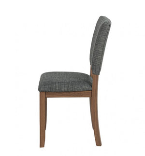 Unberto Two Tone Walnut Dining Chairs A Set of 4 A side-view dining chair with a textured gray upholstered seat and backrest on a medium brown wooden frame, shown against a plain white background.