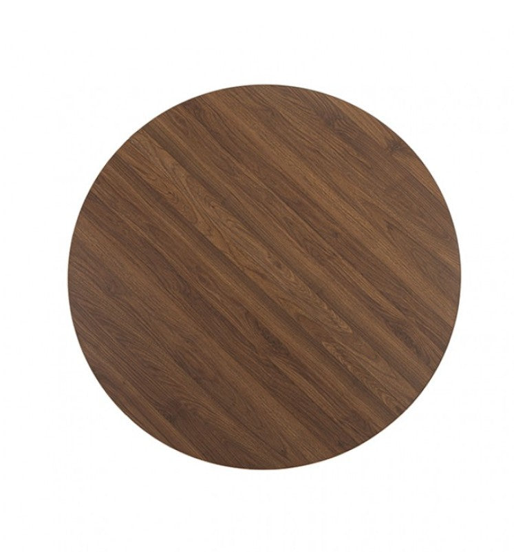 Unberto Walnut Round Dining Table A round wooden dining table with a sculptural pedestal base, surrounded by four gray upholstered dining chairs in a warm, neutral-toned dining room setting.