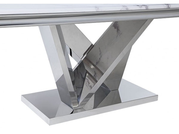 Valdi Silver White Sintered Stone Top Dining Table A modern dining table featuring a polished chrome Z-shaped metal base and a white marble tabletop with subtle gray veining, shown against a plain white background.