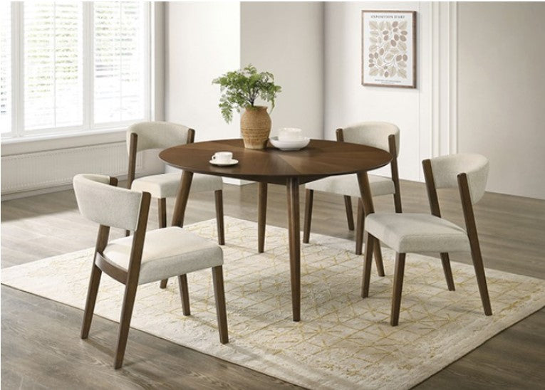 Variza Round Mid Century Modern Dining Table Dining room with a round wooden table and four chairs on a patterned rug.
