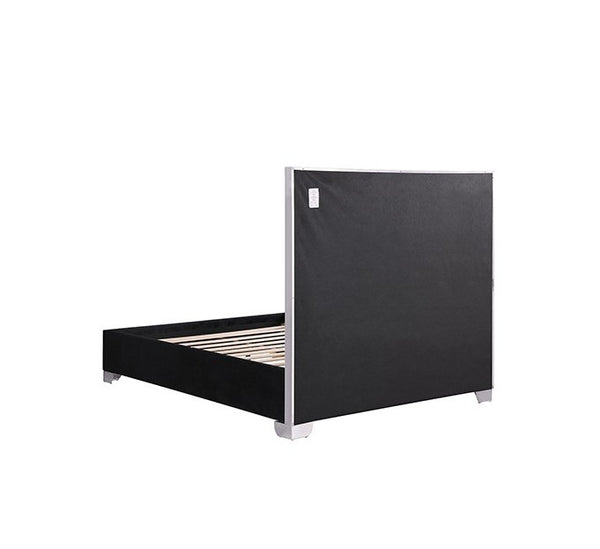 Vasiko Contemporary Glam Chrome Black Fabric Bed A modern platform bed frame with a tall black upholstered headboard and matching black footboard, supported by light wood slats and finished with silver metal legs, shown against a plain white background.