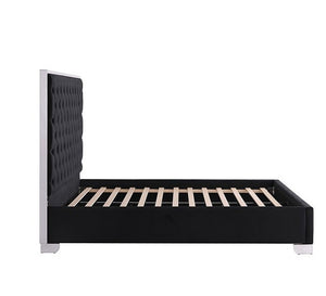 Vasiko Contemporary Glam Chrome Black Fabric Bed A modern platform bed frame with a tall, black tufted headboard and a black upholstered base, supported by light wood slats, shown against a plain white background.