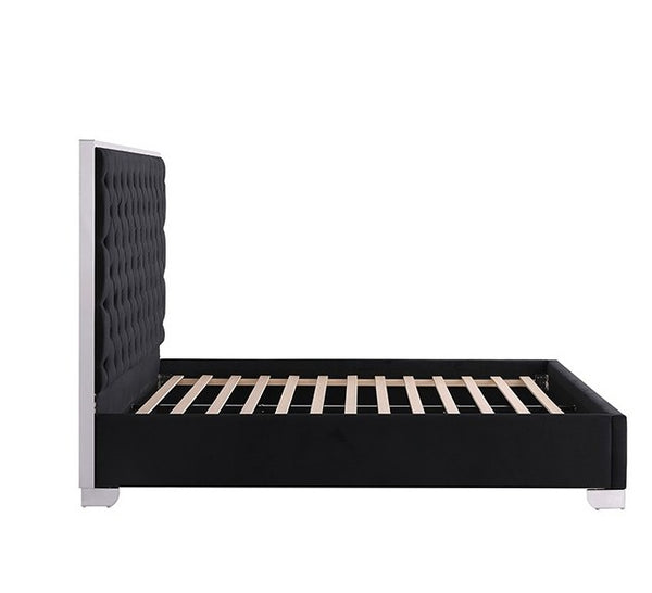 Vasiko Contemporary Glam Chrome Black Fabric Bed A modern platform bed frame with a tall, black tufted headboard and a black upholstered base, supported by light wood slats, shown against a plain white background.