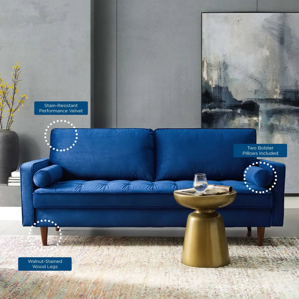 Vaspire Modern Navy Velvet Performance Sofa Blue sofa in a living room setting with a gold side table and abstract painting on the wall.