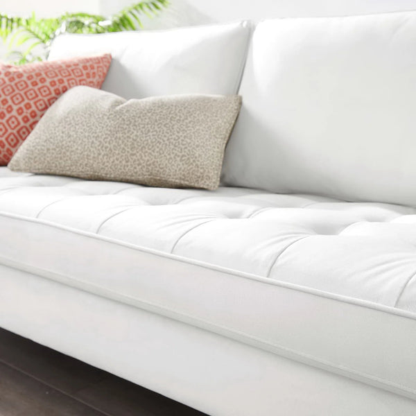 Vaspire Modern White Velvet Performance Sofa White tufted mattress topper on a bed with decorative pillows.