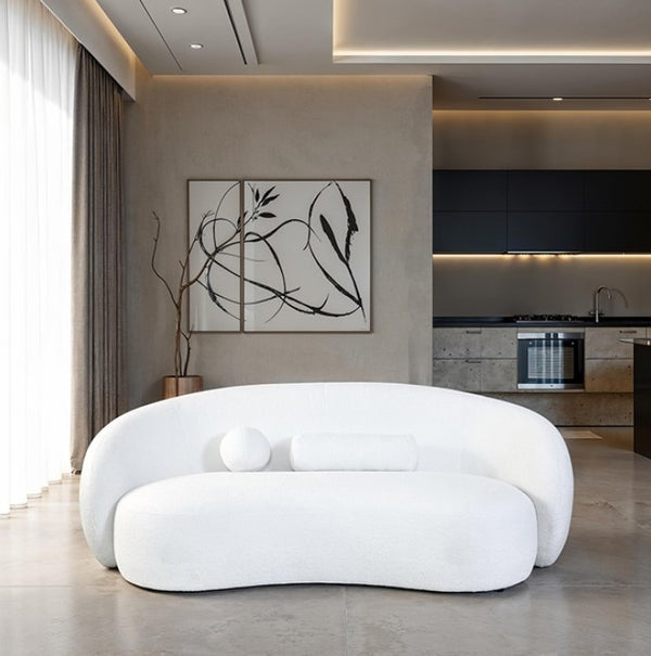 Vika Curved Back and Arm White Chenille Sofa Modern living room with a white, futuristic sofa and abstract art on the wall.