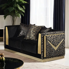 Vikki Black Gold Velvet Glam Loveseat Modern black and gold sofa with zebra print accents in a stylish room.