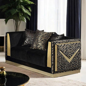 Vikki Black Gold Velvet Glam Loveseat Modern black and gold sofa with zebra print accents in a stylish room.