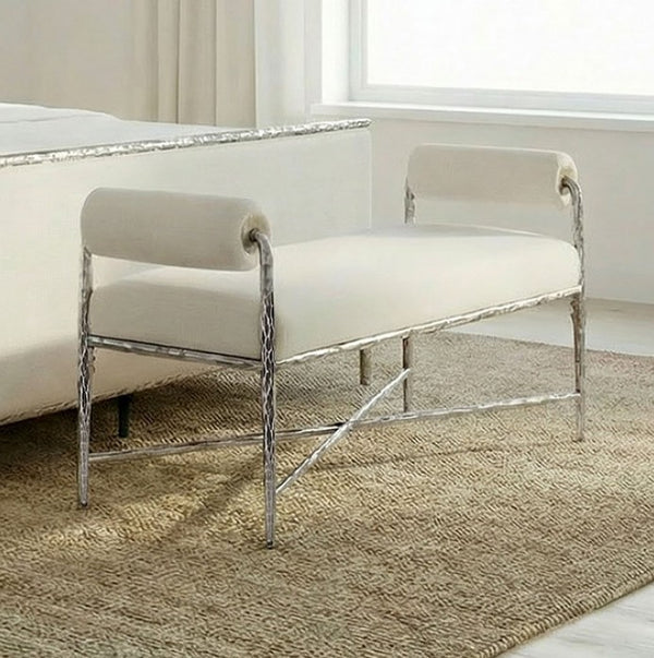 Vilber Gunmetal Silver Fully Upholstered Bench White bench with silver metal frame in a room with a window and rug.
