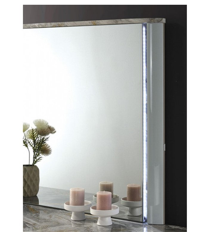 Vincenzo Modern High Gloss Finish Mirror Large rectangular mirror on a dark wall with decorative elements below.