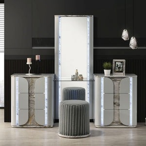 Vincenzo Modern High Gloss Finish Vanity Set Modern interior design with marble-textured furniture and gray stools.