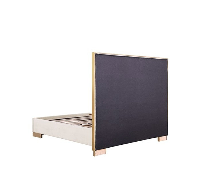 Violla Gold White Glam Upholstered Bed A modern white upholstered bed with a geometric gold headboard and gold base trim, styled in a bright, contemporary bedroom with matching white nightstands and gold accents.