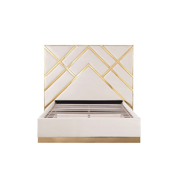 Violla Gold White Glam Upholstered Bed A modern white upholstered bed with a geometric gold headboard and gold base trim, styled in a bright, contemporary bedroom with matching white nightstands and gold accents.