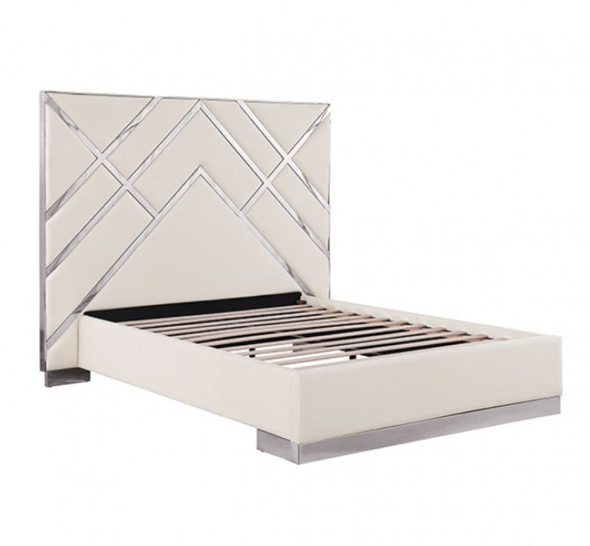 Violla Silver White Glam Upholstered Bed A modern white bed frame with a geometric diamond-patterned headboard, styled in a contemporary bedroom with white nightstands, lit table lamps, and a large arched window showing a city skyline.