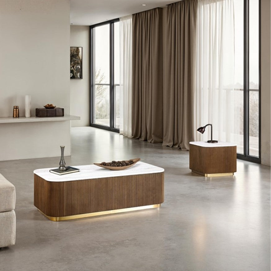 Modern coffee table with marble top and wooden base in a room setting
