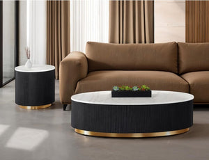 Modern living room with a brown sofa, black and gold coffee table, and side table.