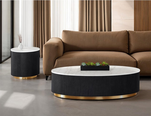 Modern living room with a brown sofa, black and gold coffee table, and side table.