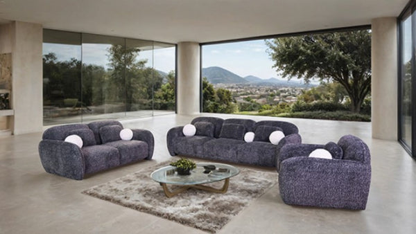 Vitally Chenille Fabric Curved Arm Sofa – Gray Modern living room with a gray sofa set and large windows overlooking a scenic view.
