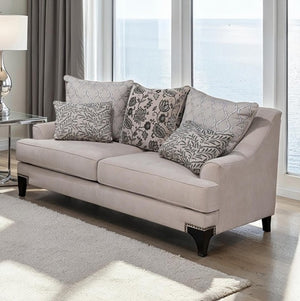 Welma Taupe Sloped Arms Loveseat with Pillows Beige loveseat with patterned cushions in a living room setting