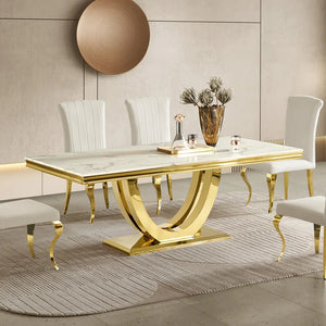 #White & Gold  Dining room with a gold and marble table and white chairs.