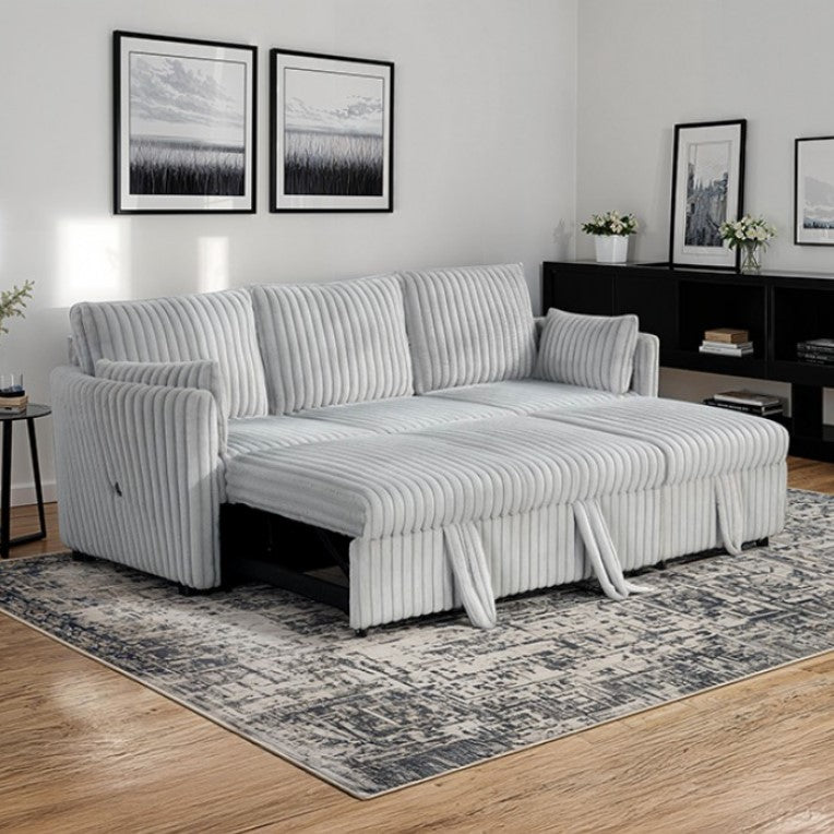 Wren Gray L Shaped Pull-Out Sleeper Sectional Sofa Gray sectional sofa in a living room with framed pictures on the wall.