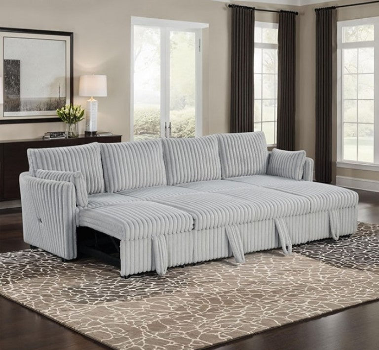 Wren Gray U Shaped Pull-Out Sleeper Sectional Sofa Gray sectional sofa in a living room with large windows and a patterned rug.