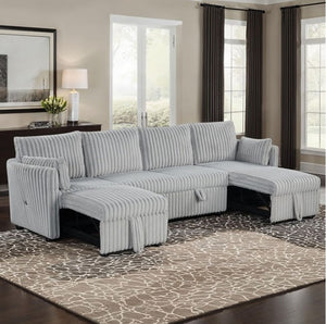 Wren Gray U Shaped Pull-Out Sleeper Sectional Sofa Gray sectional sofa in a living room with large windows and a patterned rug.
