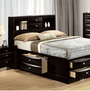 Zaven Transitional Black Storage Bed with Bookcase Headboard Bedroom with dark wood bed frame and storage drawers, light-colored bedding, and curtains.