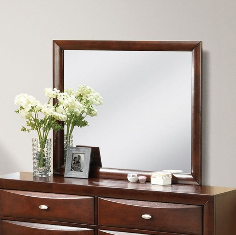 Zaven Transitional Dark Cherry Mirror Wooden dresser with a large mirror, flowers, and decorative items on top against a plain wall.